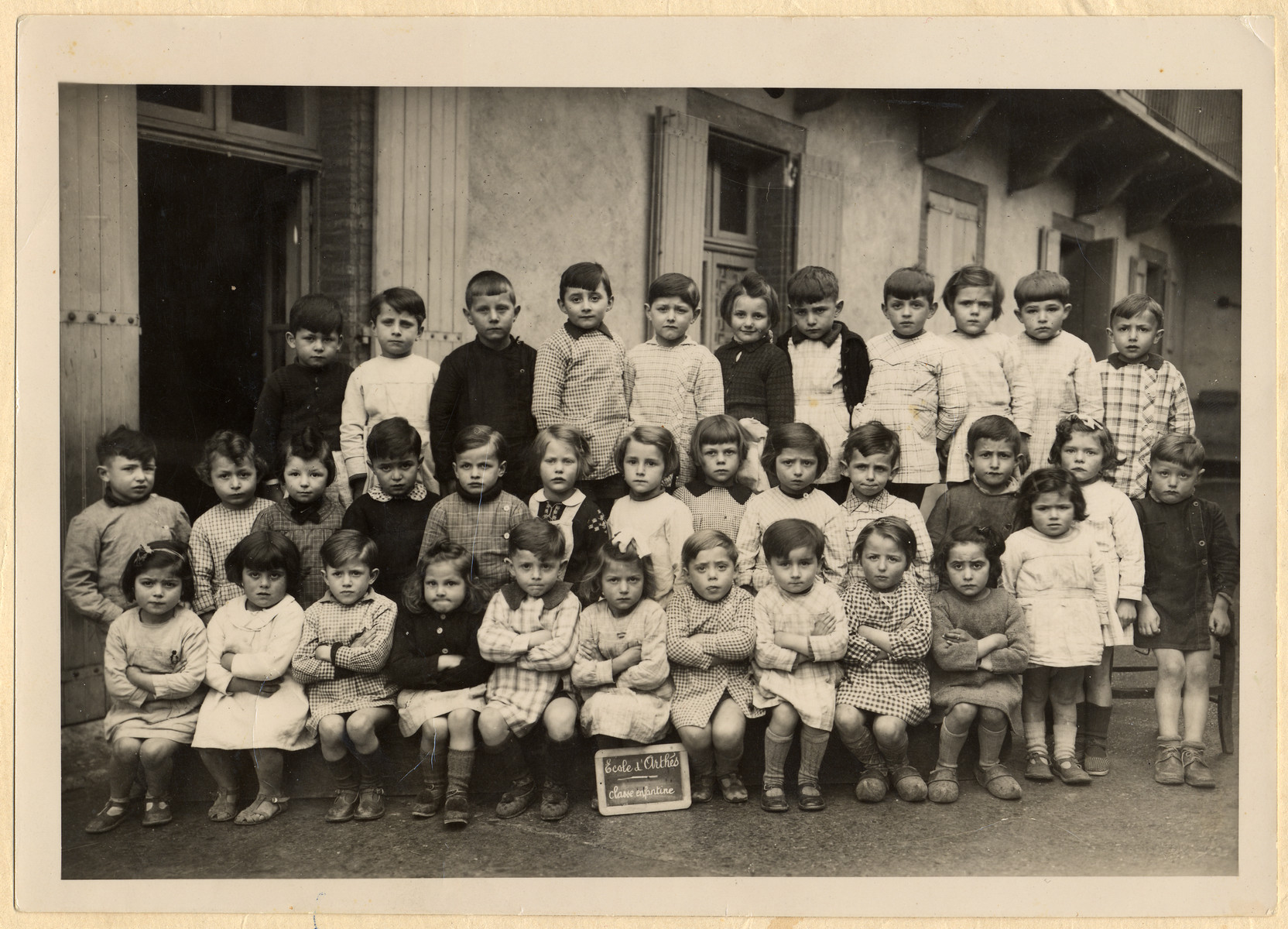 Class portrait of a kindergarten in Paris.

Among those pictured is Stephanie Bujakowski (second row, sixth from the left).  She was murdered a few years later in Auschwitz.