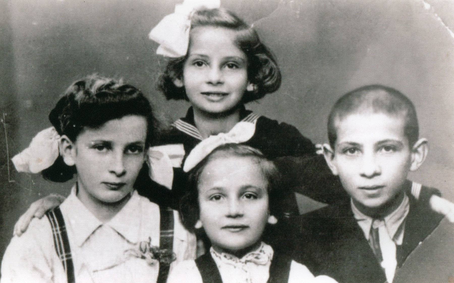 Yaffa, Sara, Tzippora and Shimon Landau.  The children escaped with their parents from Bochnia to Romania.