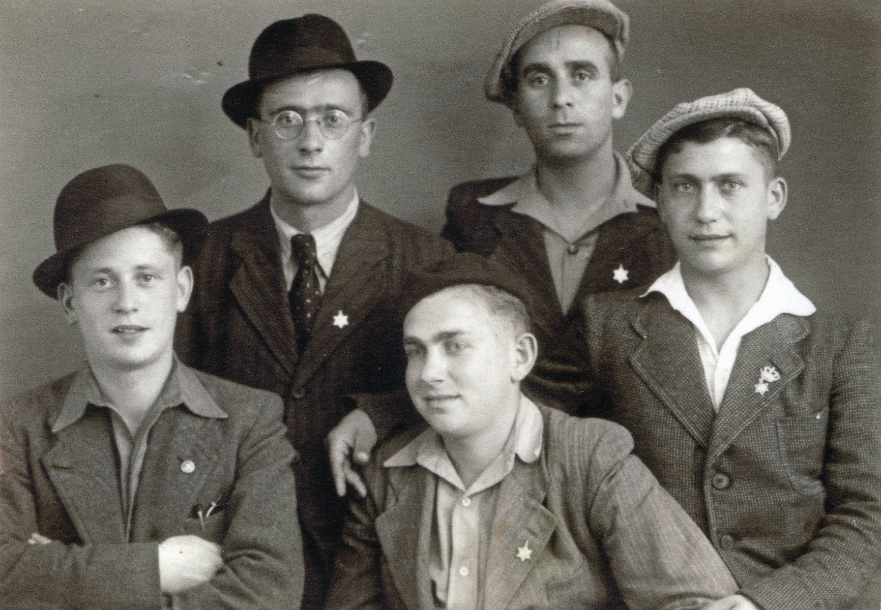 Group portrait of religious Jewish youth in an unidentified displaced persons camp.

Among those pictured are Moshe Braunfeld (lower left) and Leibish Braunfeld (right).  They sent this photograph to their sister Elissa in Palestine to prove they were still alive.