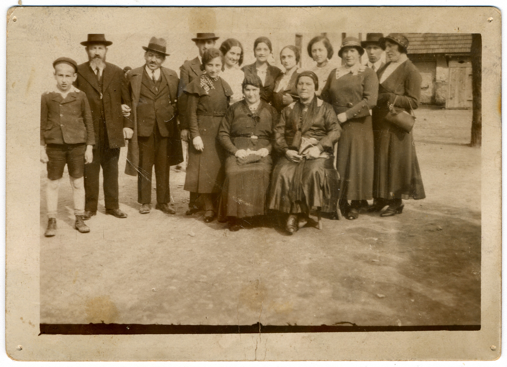 A large Orthodox family gathers together on the Jewish holiday, Lag Ba'Omer.

Seated are: Sharika Frieder (wife of Pinchas Frieder), Mali Grunfeld (Malvina's mother).  Standing are: Walter Jungleib (son of Arye Jungleib and Malvin Frieder, daughter of Pinchas Frieder), Pinchas (Philip) Frieder (cantor and shochet in Prievidze, CZ), Arye Jungleib, (boy in back) cousin to Rabbi Lebovich's daughters, (girl in front) girlfriend of Malvina's from Galanta, daughter of Rabbi Lebovich from Bratislava, ?  Fruchter (sister-in-law to Malvina's sister, Zali), daughter of Rabbi Lebovich from Bratislava, Helen Weinstein (Malvina's sister), Avraham (Rumi) Grunfeld (Malvina's brother, Lenke Grunfeld (Malvina's sister)