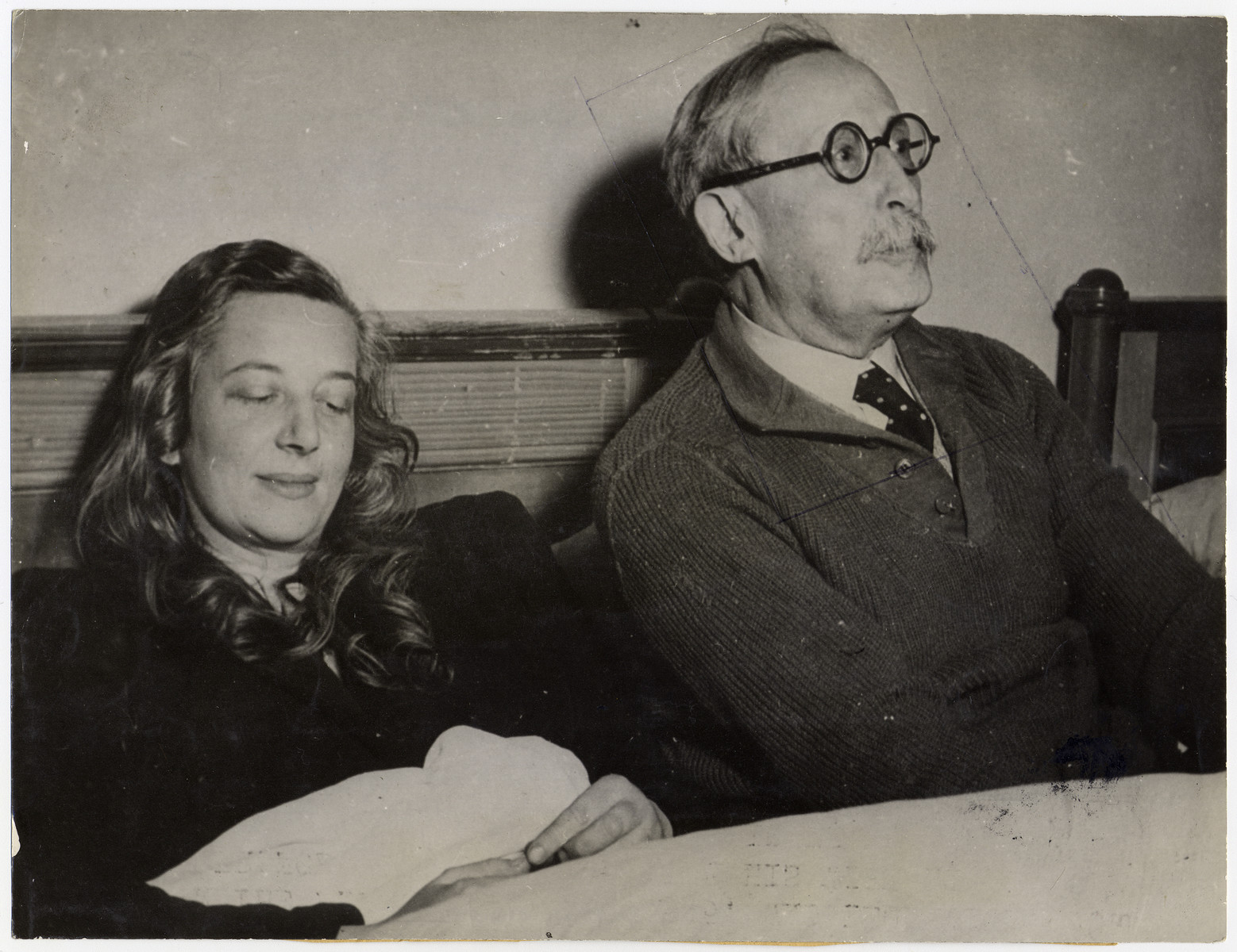 Portrait of former French Prime Minister Leon Blum and his wife, following their liberation.

Original caption reads: "Among the famous personalities freed by Allied troops from the German concentration camp at Lago di Braies in the Alps, in Italy, on May 4, 1945, was Leon Bloom, former Prime Minister of France, who is shown with his wife at the camp. Blum disclosed that he had been a prisoner in France until March, 1943, when the Gestapo took him to Germany with Deladier and General Gamelin. Confined at Buchenwald, he was guarded by 20 SS men with especially trained police dogs. Later he was taken to the Alpine camp for perpetual confinement, without having a trial. Although suffering from lumbago and bronchitits, Blum shook hands energetically with his Liberators. During five years of imprisonment, Blum and his wife listened secretely to BBO broadcasts."