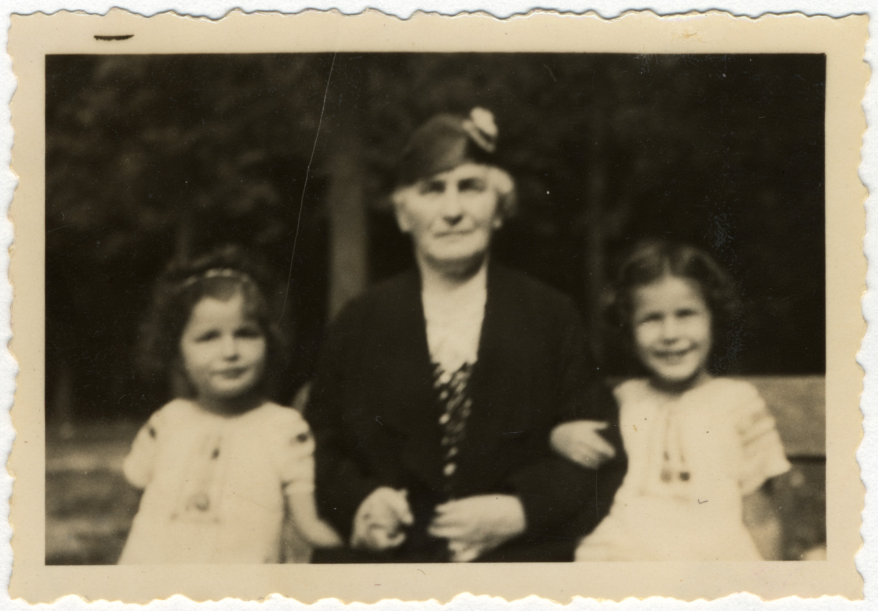 Jacqueline (left) and Manuela Mendels (right) go for a walk with their paternal grandmother, Thekla Marx Mendels.

Their grandmother later perished in Sobibor at the age of 70.