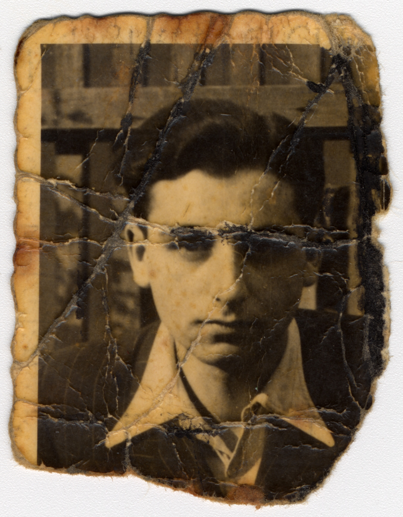 Close-up portrait of a young man in the Bedzin ghetto. 

Pictured is Alex Lieberman, donor's brother-in-law.  The portrait was found in "Kanada" section in Birkenau in 1944 and brought to his mother, Rosa Lieberman.  Rosa hid this photograph in her mouth through every selection and search during her imprisonment in Birkenau, and she later carried it with her on death marches to Ravensbrueck and Neustadt-Gleve.