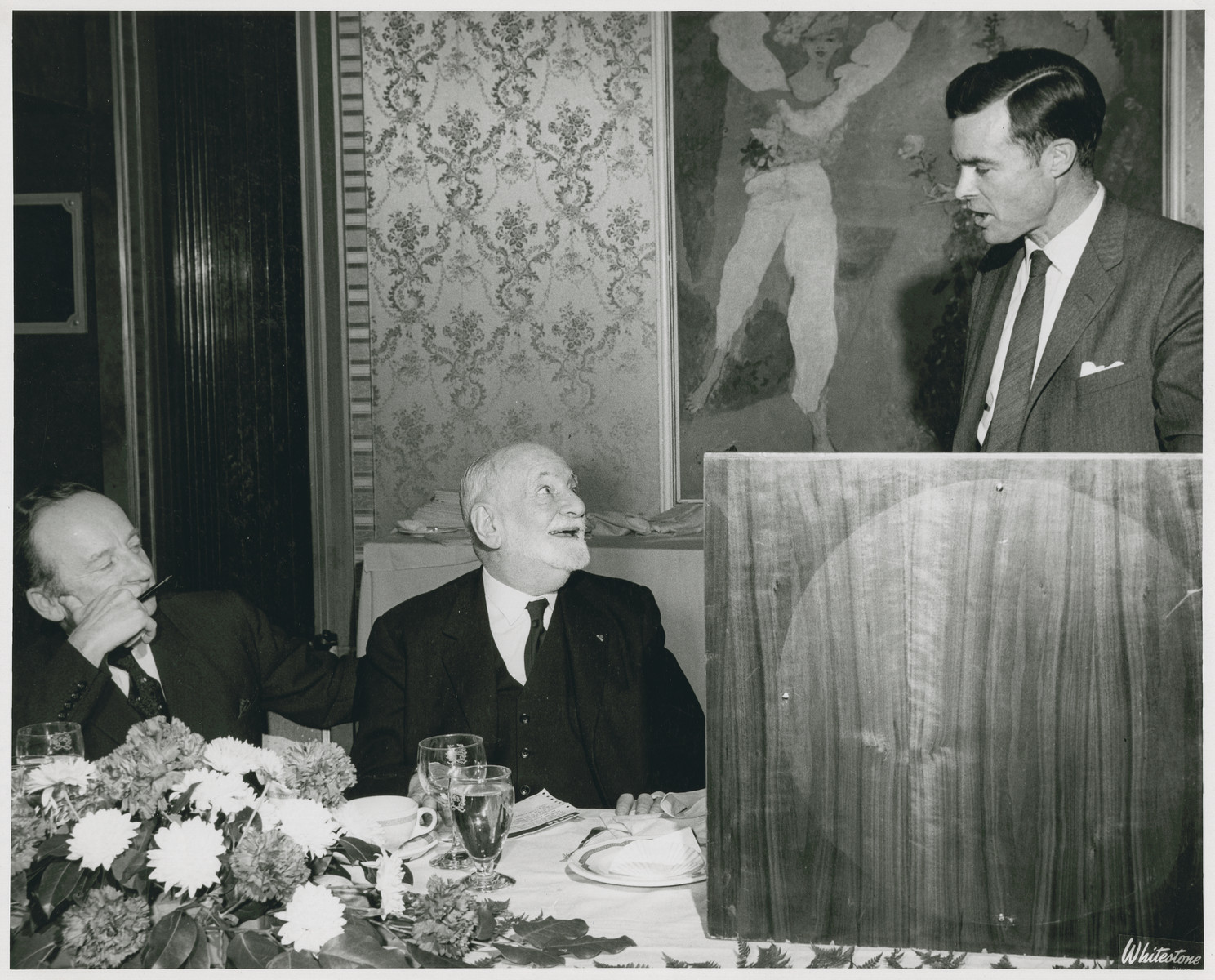 Benjamin Ferencz and Rene Cassin look on as John Carey speaks at an event in New York City hosted by Bnai Brith honoring Rene Cassin.  

Cassin was awarded the Nobel Peace Prize in 1968 for writing the Universal Declaration of Human Rights that was adopted by the United Nations.