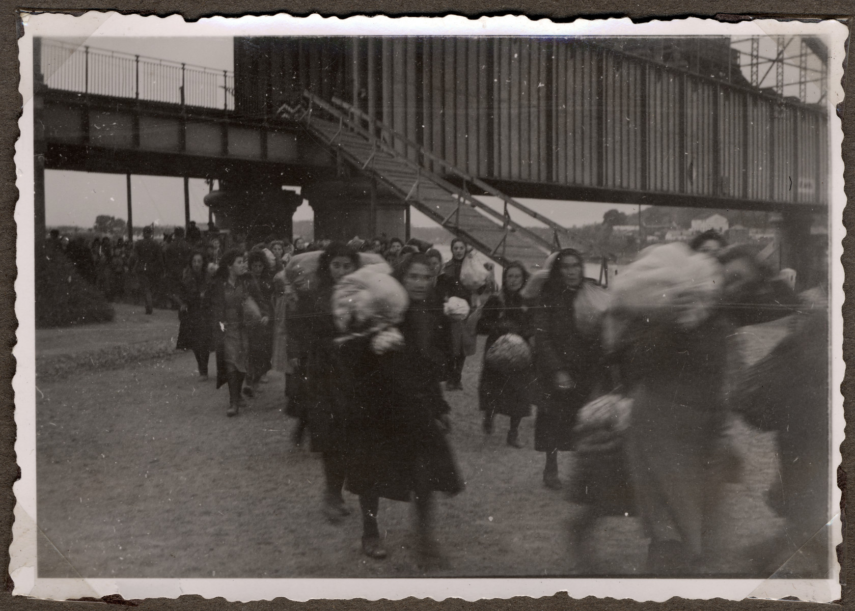 Jews move their belongings on carts and wagons from downtown Kaunas to the new ghetto located across the river in Slobodka.