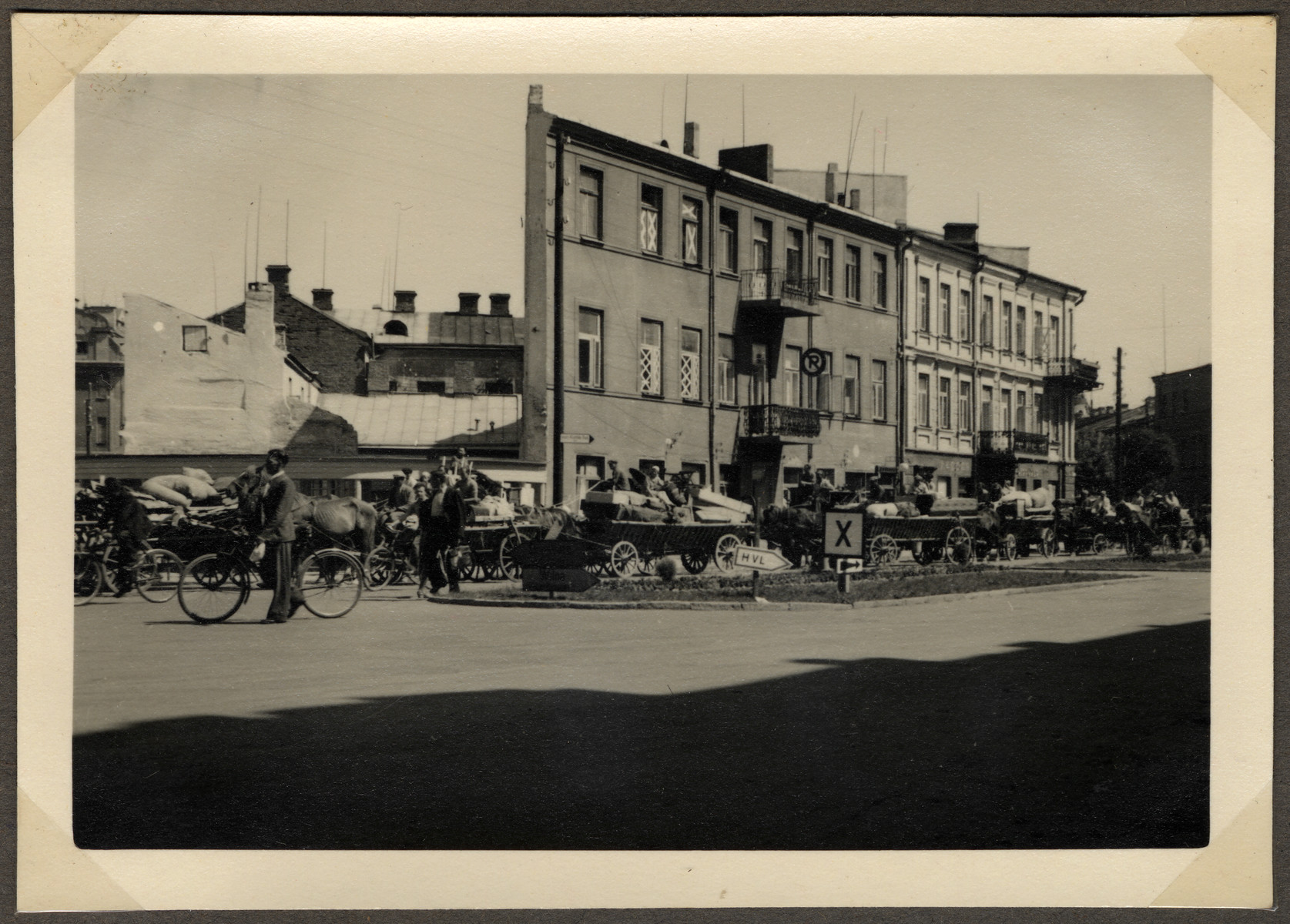 Jews move their belongings on carts and wagons from downtown Kaunas to the new ghetto located across the river in Slobodka.