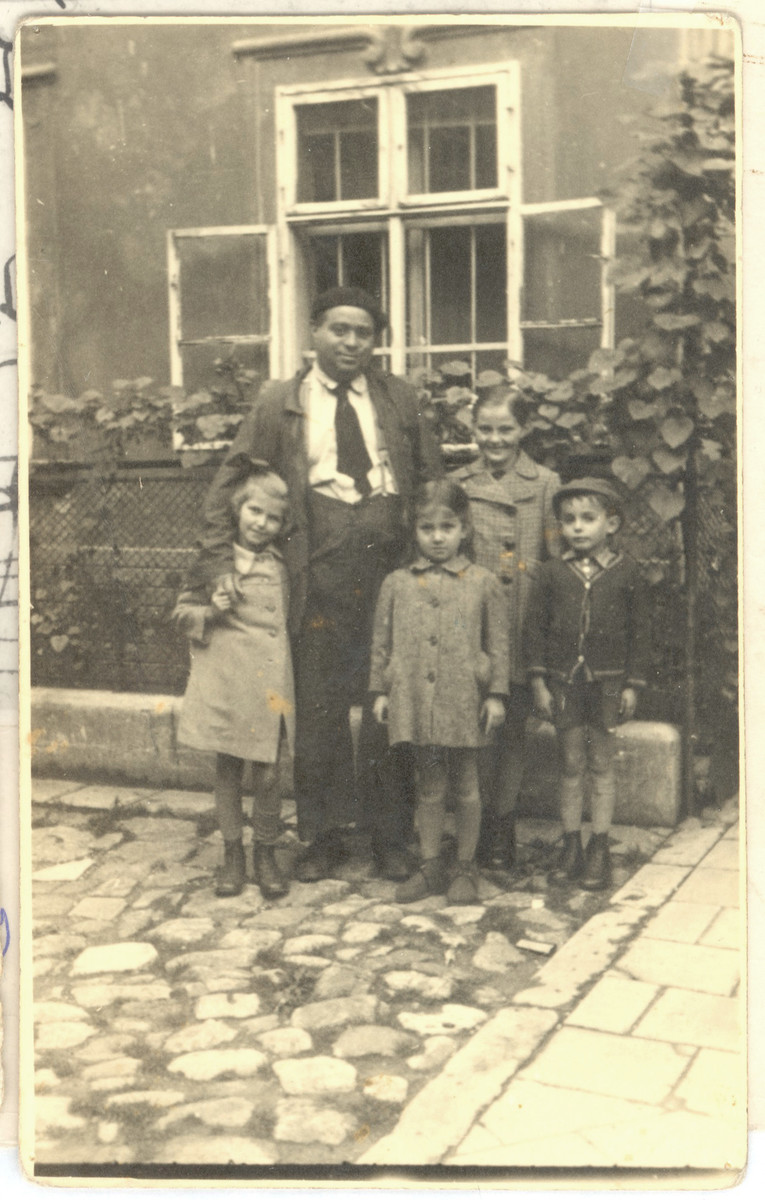 Jonas Eckstein poses with Jewish orphans from Poland that he sheltered after they were smuggled over the border into Slovakia.

Among those pictured are Miriam Ater Ovide (front left) and her sister Lola Ovide (back, center.).