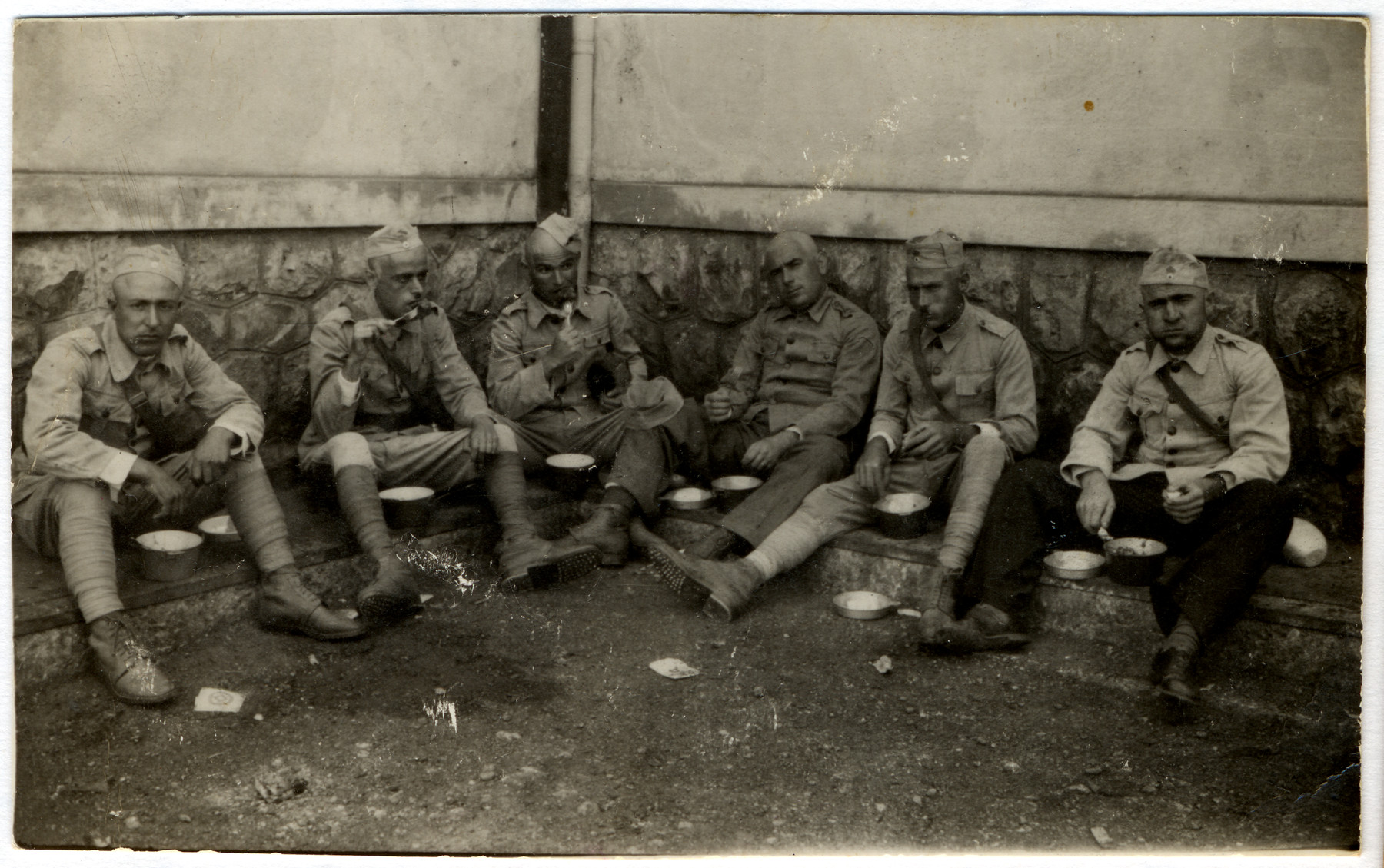 A group of Greek soldiers eat a meal.

Among those pictured is Jacob Elhai.