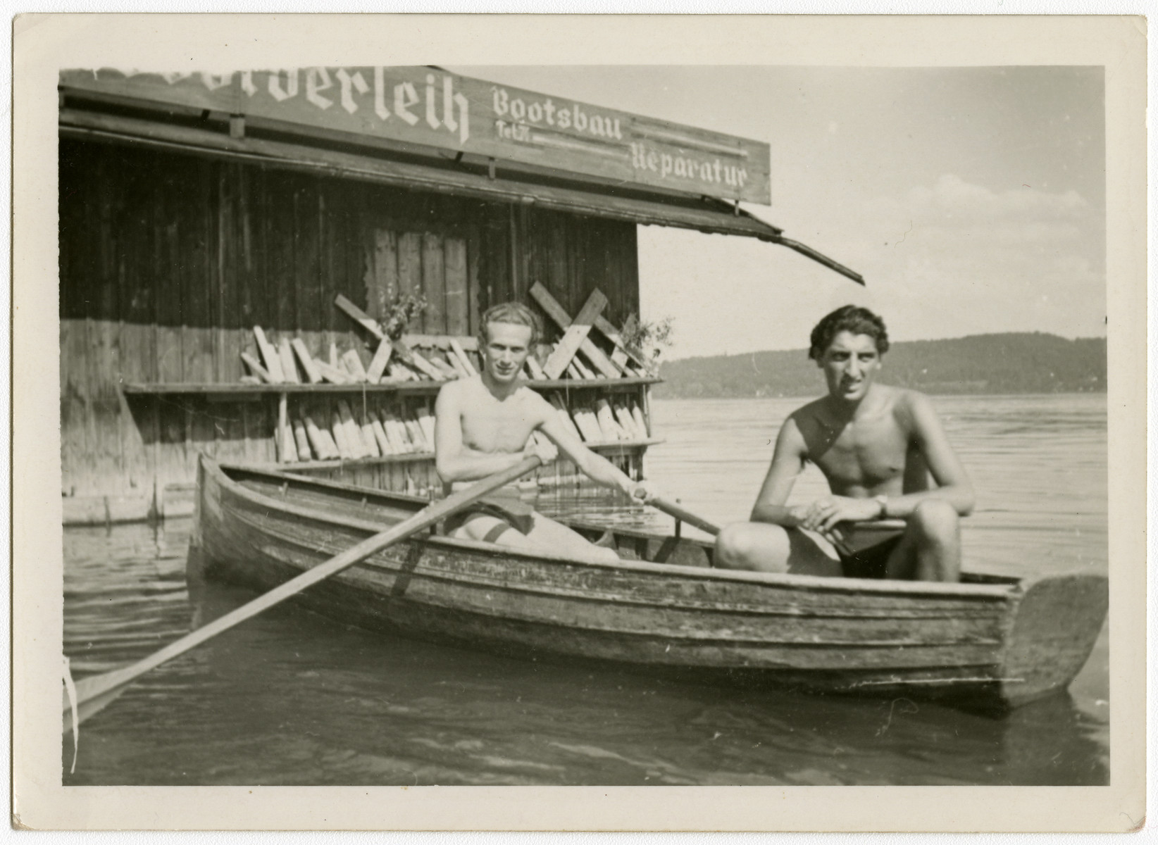 Two young men go boating on the Starnberger Sea near the Feldafing displaced persons camp.

Henek Haberman is on the left and Chamek (Harry) Weinroth is on the right.