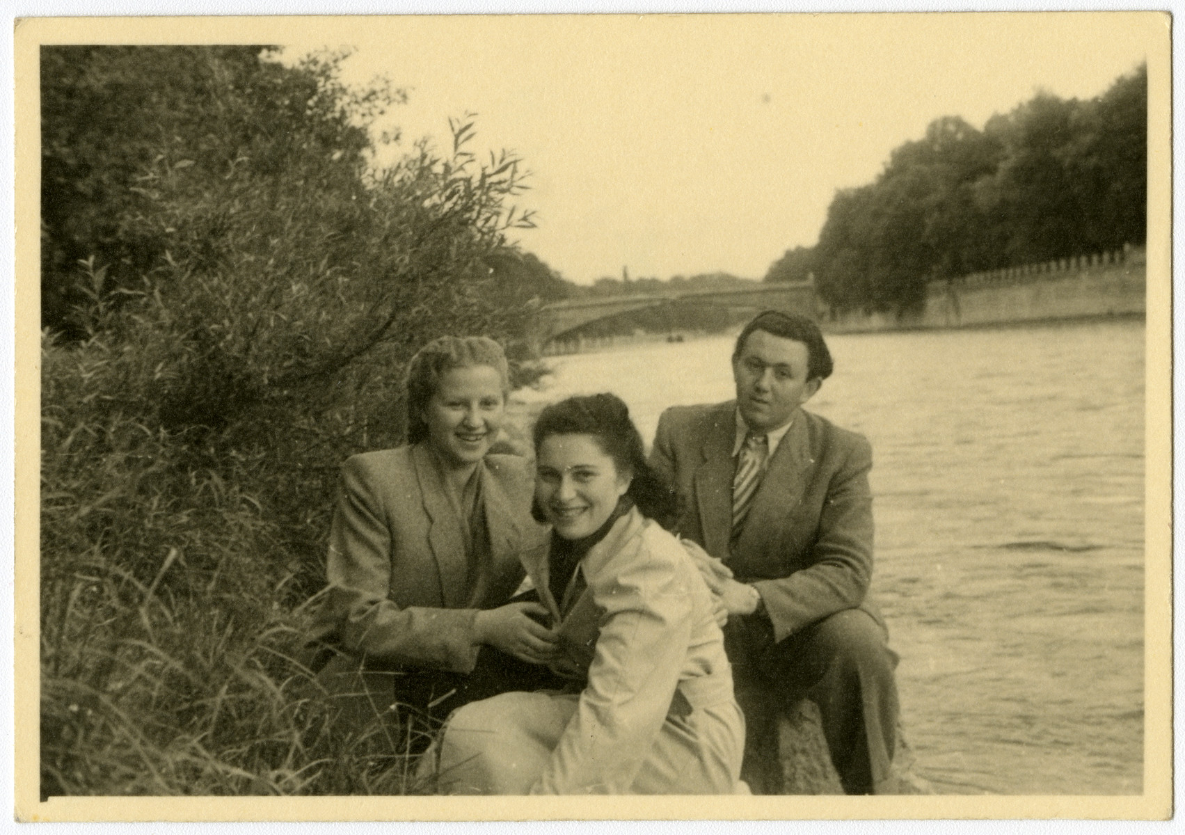 Three friends sit on the bank of the Starnberger Sea in the Feldafing displaced persons camp.

Pictured are Luba Kerschenblat, Frieda Wilner and Yeshayahu Zycer.