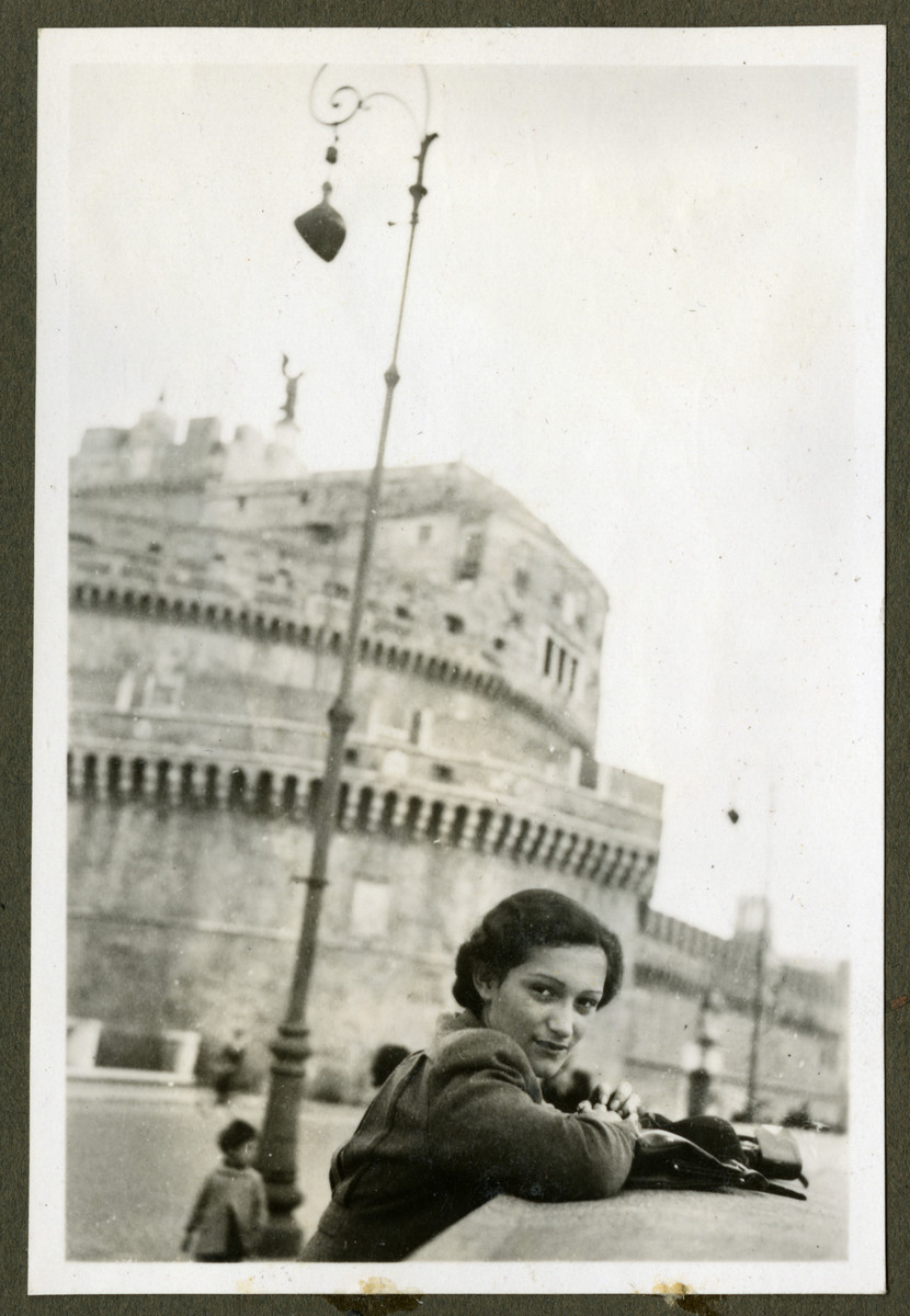Helga Reinsch leans over a wall while on vacation in Rome.

This picture came from a photo album of photographs taken in the late 1930s.  Some in Cuba and some from various family vacations.