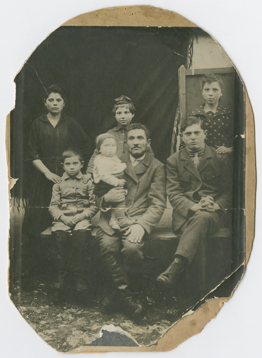 Portrait of the Braziler family.  

Pictured  are Brane, Libe, and Sylvia Braziler. Copl Braziler is seated at center holding his infant son George (later Bresalier).  Two unidentified family members are also present  George and Sylvia Braziler were the only members of their immediae family to survive the Holocaust.