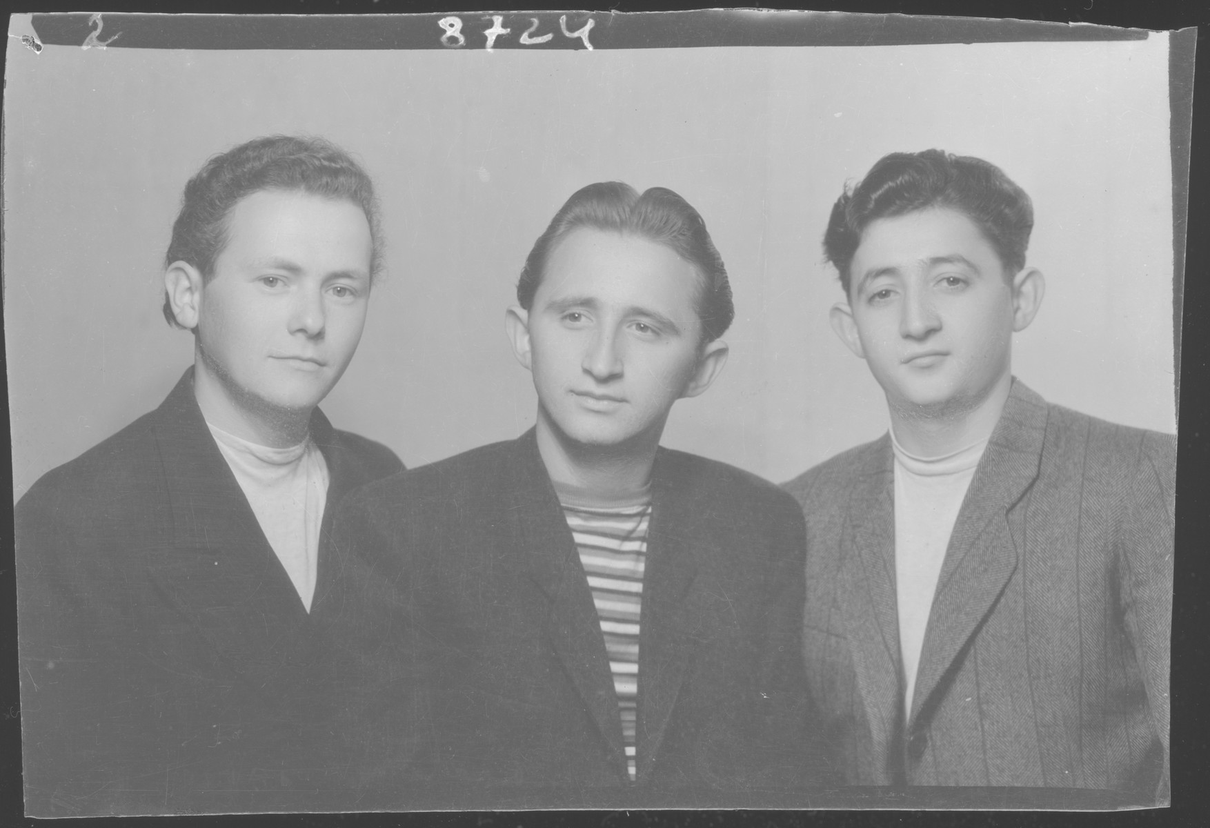 Studio portrait of Zolta Grunfeld and two other young men.