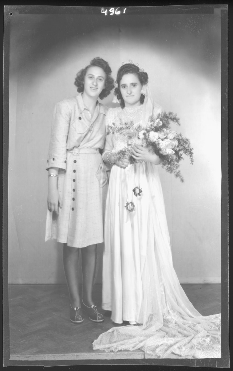 Studio portrait of the bride of Albert Grunwald and her sister.

Irina Klein is pictured on the left iand the bride is Sarah Klein Grunwald.
