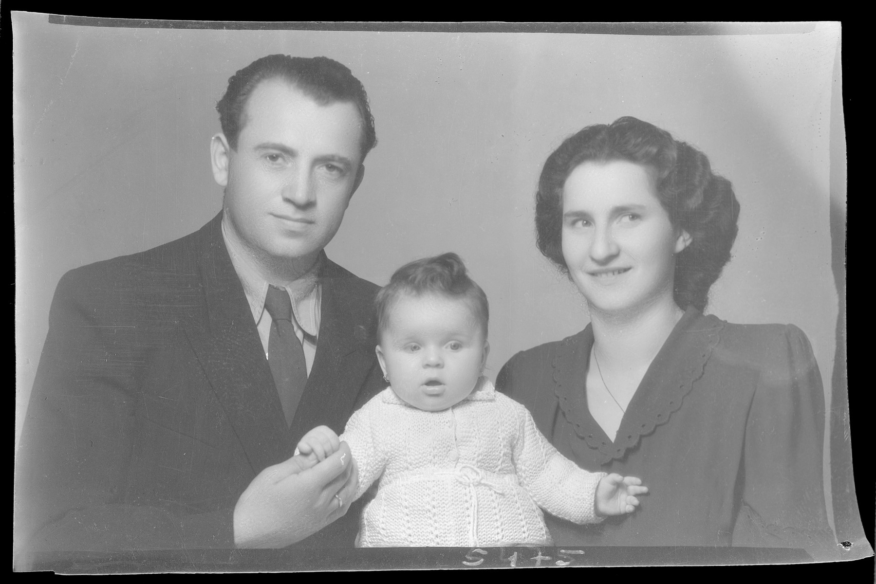 Studio portrait of Mihaly Goldstein, his wife and child.
