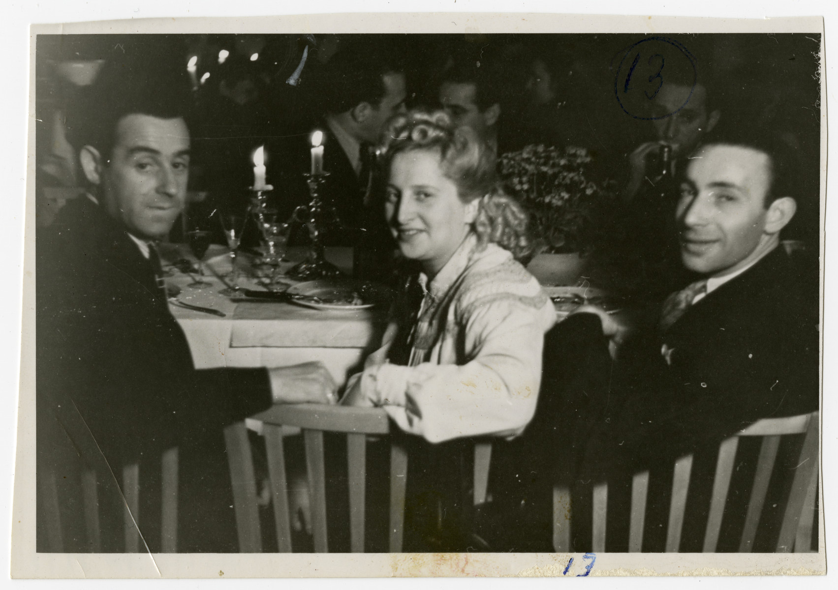 Solomon Manischewitz (left) enjoys a Shabbat dinner with his wife Sara and an unidentified friend.