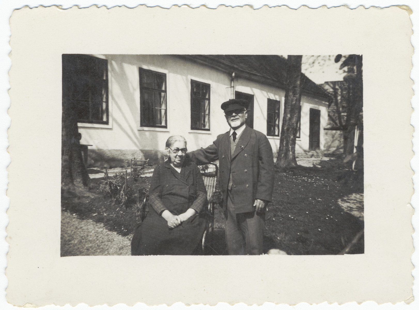 A rabbi and his wife pose in front of their home which also served as the town's synagogue.

Pictured are Rabbi Leopold and Katarina Deutsch.