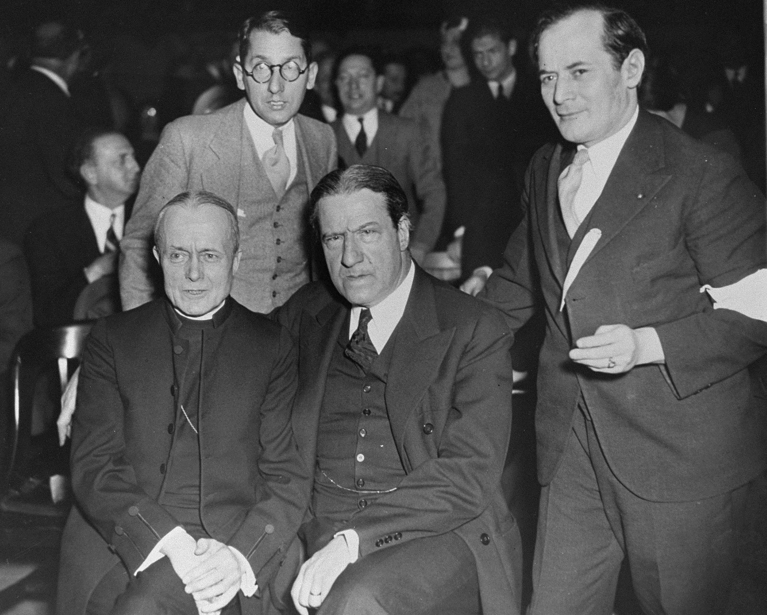 Bishop William T. Manning (lower left) and Rabbi Stephen Wise (center) attend a mass rally at Madison Square Garden to protest against the enactment of anti-Jewish legislation by the Nazi regime and the acts of terror and incitement against German Jewry perpetrated by the new government.