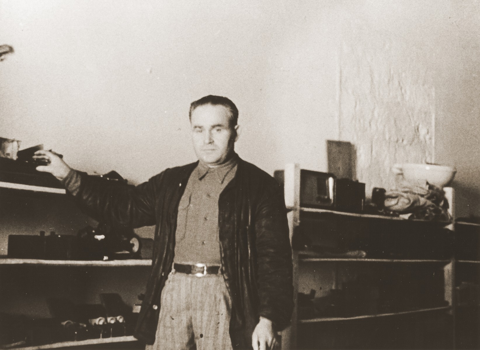 Portrait of a Jewish DP working at the ORT warehouse in the Cremona displaced persons camp.

Pictured is Motel Leikach.