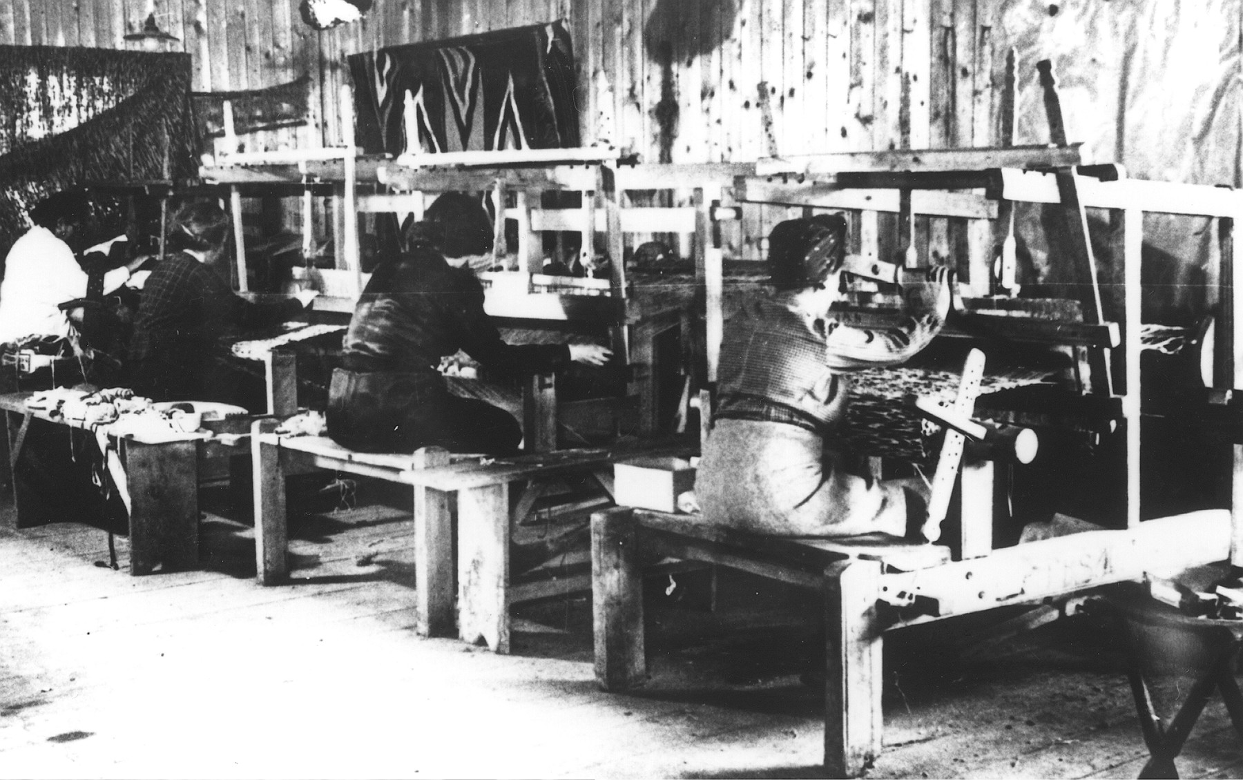Women prisoners weaving textiles in a workshop in the Novaky labor camp.
