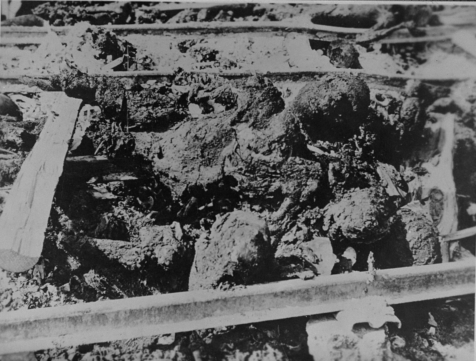 Partially burned corpses left by the hastily retreating Nazis.