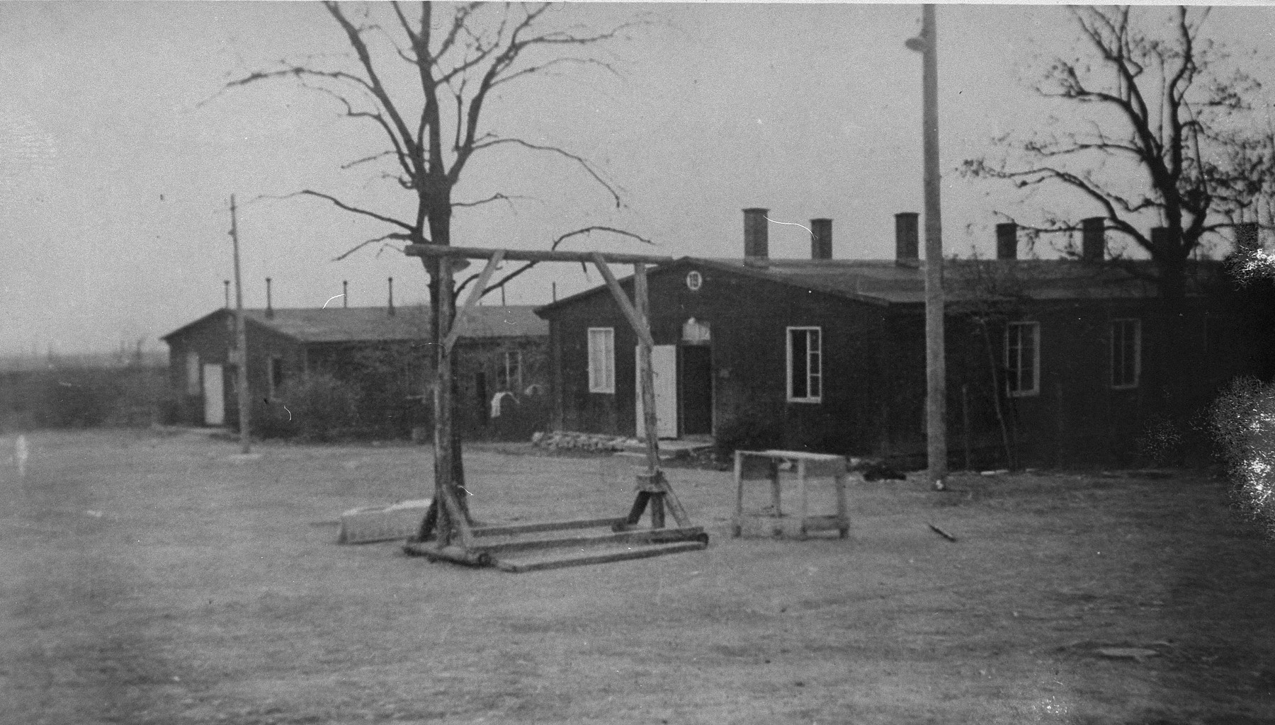 View of the gallows and barracks in the Ohrdruf concentration camp.