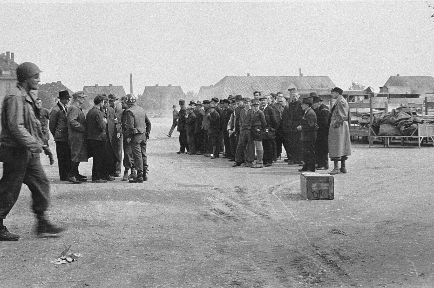 German civilians are assembled before being detailed to collect and bury the victims of the Langenstein-Zwieberge concentration camp.