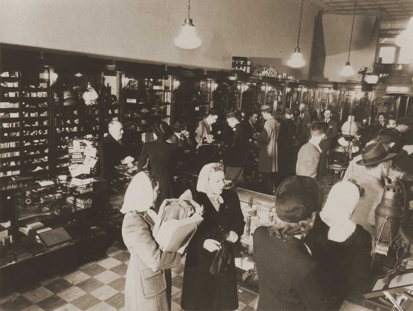 Customers wait in line for service at the Brenner Photo company on Pennsylvania Avenue in Washington, D.C.