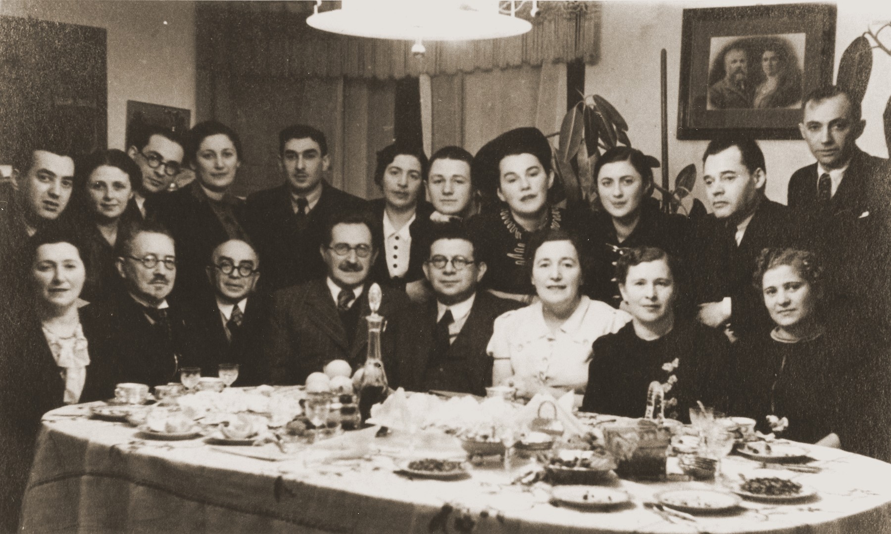 Dr. Aharon Pick hosts a dinner for the Jewish dramatist Nathan (Bistritski) Agmon, who is visiting from Palestine.

Dr. Pick is pictured seated, fourth from the left.

Haia Nudel (b.1928) is the daughter of Gitta and Leib Nudel of Siauliai, Lithuania, where Leib worked at the railway station.  Haia had two brothers, Mordechai (b.1930) and Yaakov (b.1933).  Soon after the German occupation of the city in the summer of 1941, Haia's father was killed.  The rest of the family was forced into the ghetto.  When her brother, Mordechai, attempted to escape, he was shot and killed.  The remainder of the family stayed in the ghetto until its liquidation in the summer of 1944.  At that time they were all deported to the Stutthof concentration camp.  Only Haia survived.  After the war, Haia made her way to Germany, where she lived for a time in the Foehrenwald DP camp.  In the fall of 1946, she joined a group of would-be immigrants to Palestine who attempted to run the British blockade aboard the Latrun.  The ship, however, was intercepted and its passengers deported to Cyprus.  Haia spent nine months in Cyprus detention camps before being allowed to enter Palestine in May, 1947.

David Pick (b.1922) is the son of Deborah Tatz and Dr. Aharon Pick of Siauliai, Lithuania.  In addition to his medical practice, David's father was active in Jewish cultural life.  The family hosted many visiting Jewish cultural figures.  During the war David's father succumbed to illness while living in the Siauliai ghetto.  His mother survived the ghetto but perished in the Stutthof concentration camp.  David managed to flee the ghetto shortly before its liquidation.  He was hidden by a Lithuanian priest for three weeks before the area was liberated.  After the war David became a guide for the Bricha, leading groups of Jewish survivors on routes to the west.  David immigrated to Palestine in 1948.  There, he met Haia Nudel and the two were married in 1949.