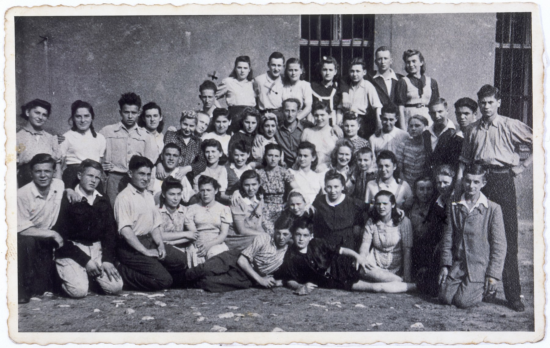 Group portrait of the members of a Shomer Hatzair kibbutz hachshara (Zionist collective) in Sosnowiec, Poland.

Among those pictured is Hela Kolin, top row, third from the left.