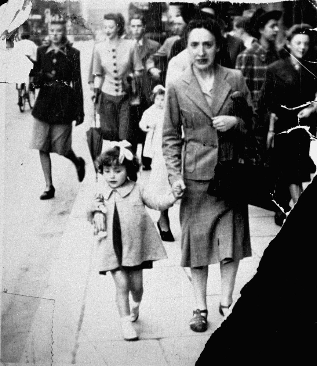Rajala Lederman walks along a street in Brussels with her daughter Annette.