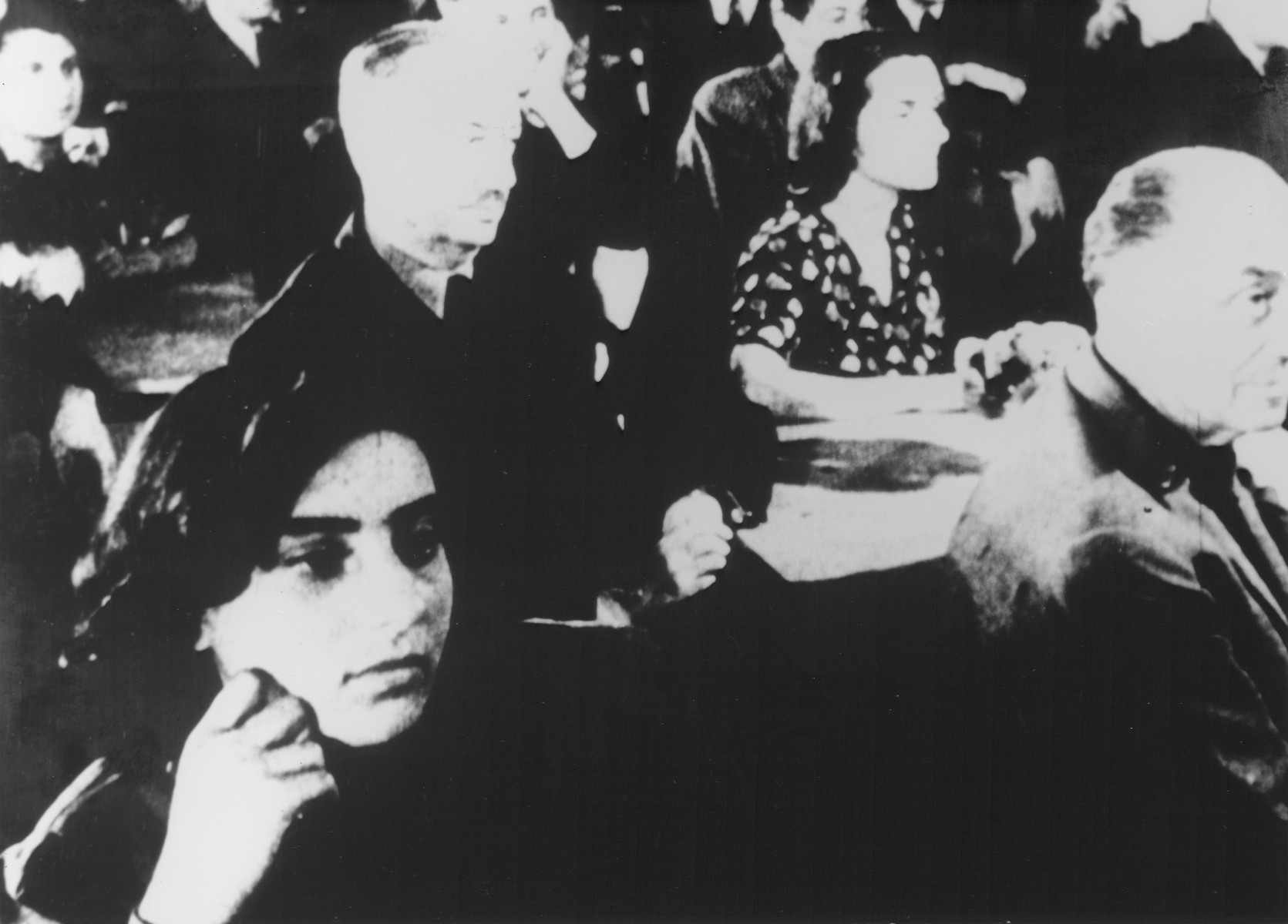 STILL PHOTOGRAPH FROM THE NAZI PROPAGANDA FILM, "Der Fuehrer Schenkt den Juden eine Stadt" [The Fuehrer gives the Jews a City].  Jewish prisoners sitting in an audience in the Theresienstadt ghetto.