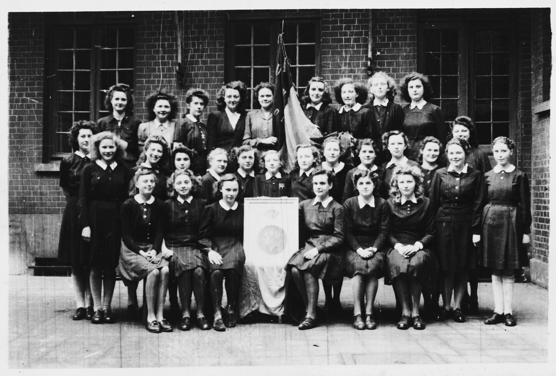 Group portrait of students at Les Soeurs de Notre Dame convent school.

Hena Kohn is pictured in the top row, second from the left.