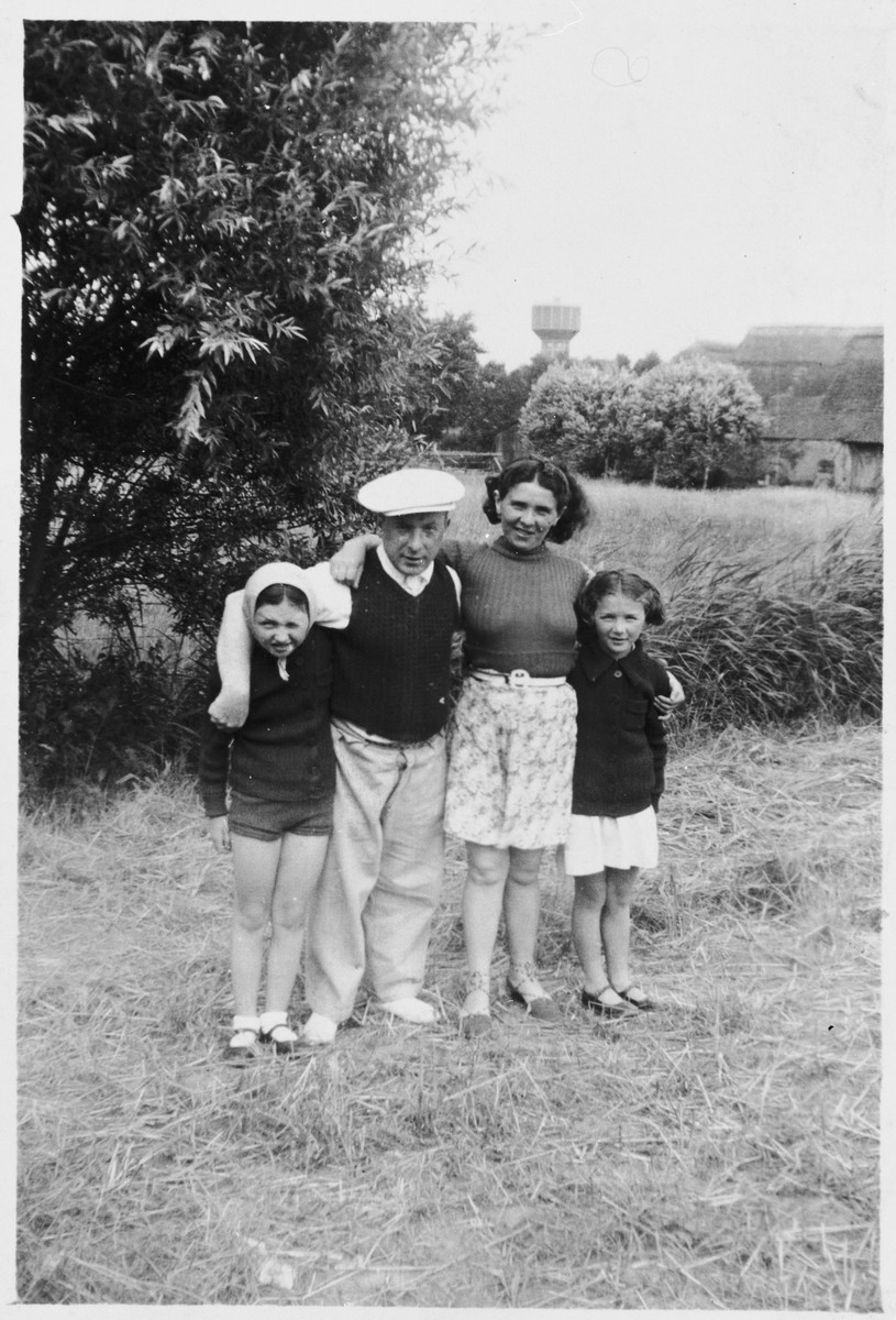 Members of the Kohn family pose outside in a field.

Pictured from left to right are Hena, Herschel, Ita Rivka and Pola Kohn.