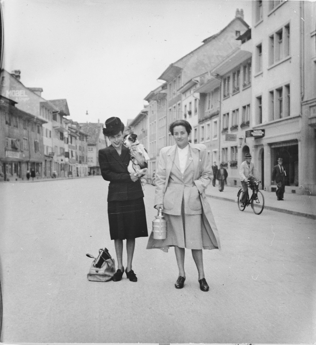 Frieda Belinfante (right) poses with a friend on the Steinbergasse, a historic street in Winterthur, Switzerland.

The photograph was taken shortly after she was allowed to leave the refugee camp Hotel Pellerin.