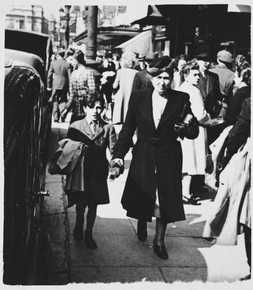 Helen Gutwirth walks down a street in Belgium with Freddy, an orphaned relative form Vienna whom the Gurwirth family was helping.