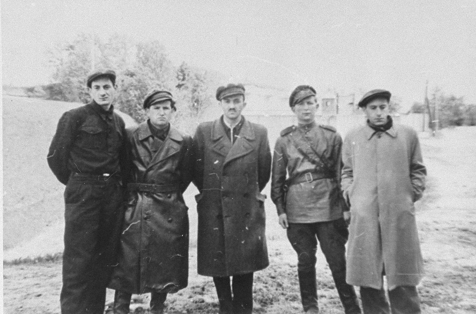 Group portrait of Jewish resistance fighters and participants in the Christmas 1943 escape from Fort IX in front of the fortress ten months after the liberation.

Pictured from left to right are: Pinia Krakinovski, Berl Gempel, Meir Yellin, Israel Gitlin and Wladyslaw Blum(?).