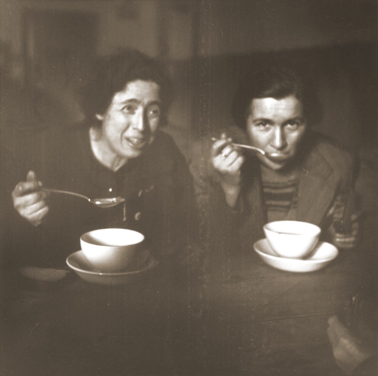 Two Jewish women rescued from Theresienstadt enjoy a warm meal in the Hadwigschulhaus in St. Gallen.