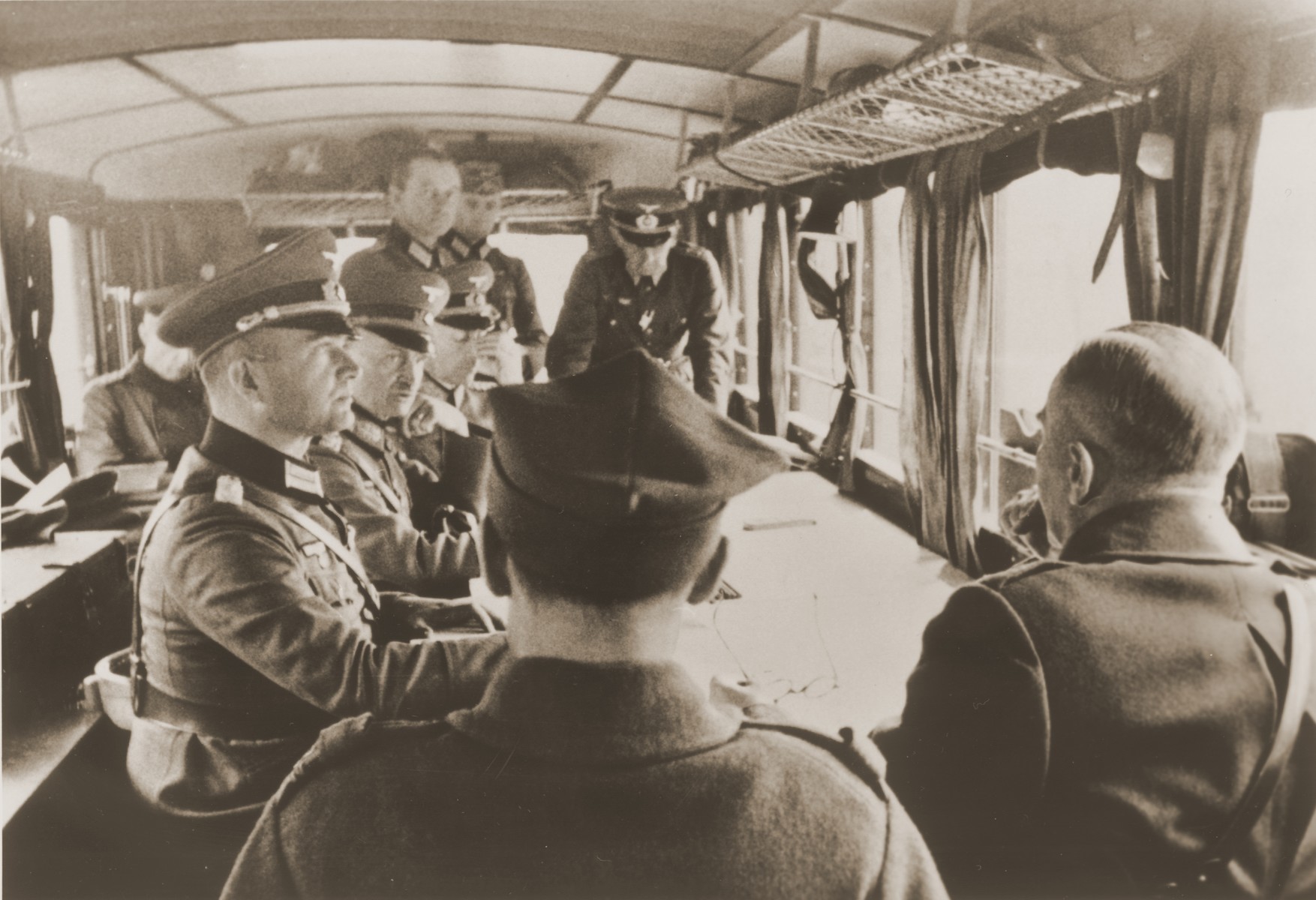 German General Blaskowitz (left, center of the table) presides over the official surrender of the Polish Army in a railway car at the Skoda Motor Works near Warsaw.