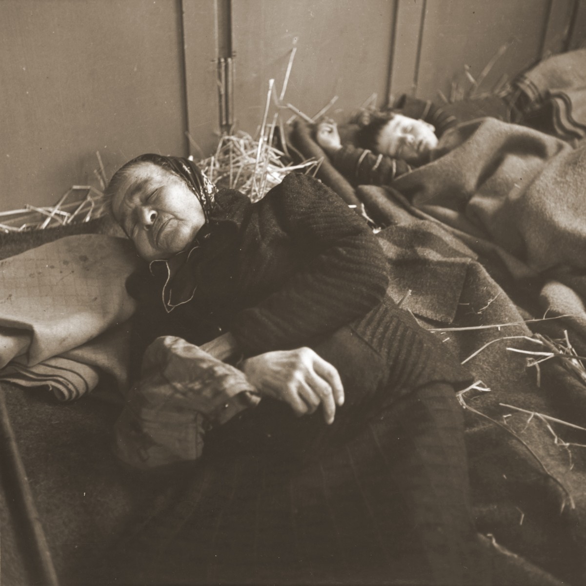 An elderly Jewish woman and a child rescued from Theresienstadt  rest in the Hadwigschulhaus in St. Gallen.