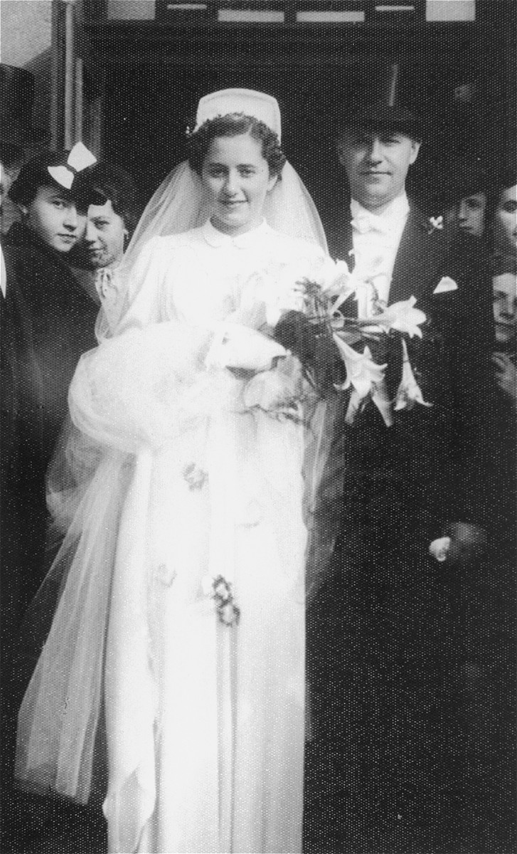 Wedding portrait of Dr. Laszlo Halmos and Katarina Kertesz, taken in front of the Neolog synagogue in Kosice, Slovakia.