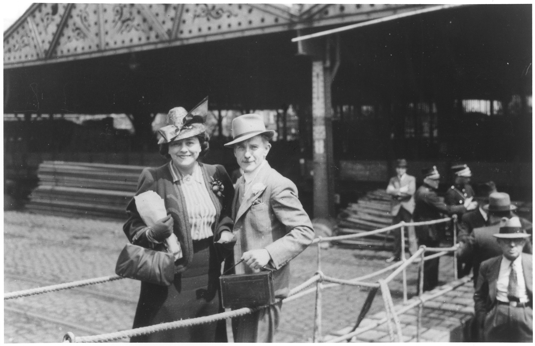A Jewish refugee couple poses on the gangway of the MS St. Louis as they disembark from the ship in Antwerp.
