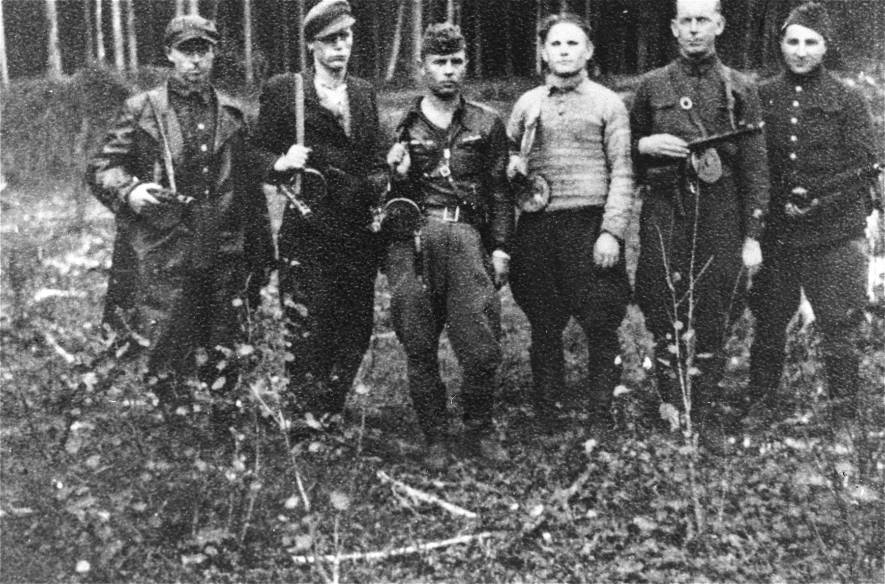 A Jewish partisan group in the Rudninkai forest.  

On the far right is Max (Motl) Wischkin.  Moshe Abramovytz (b. 1917 in Kosvo Polska) is fourth from the right.