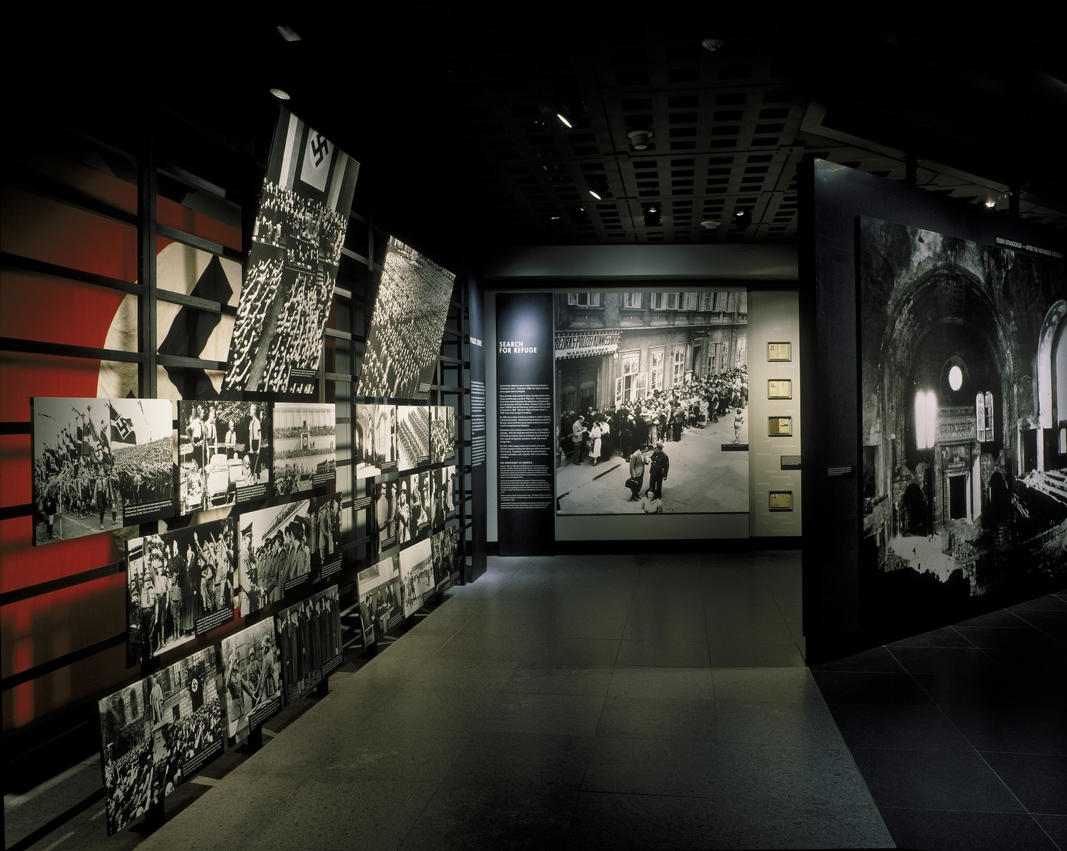 View of the "Nazi Society" segment of the permanent exhibition at the U.S. Holocaust Memorial Museum (left), looking toward the "Search for Refuge" segment.