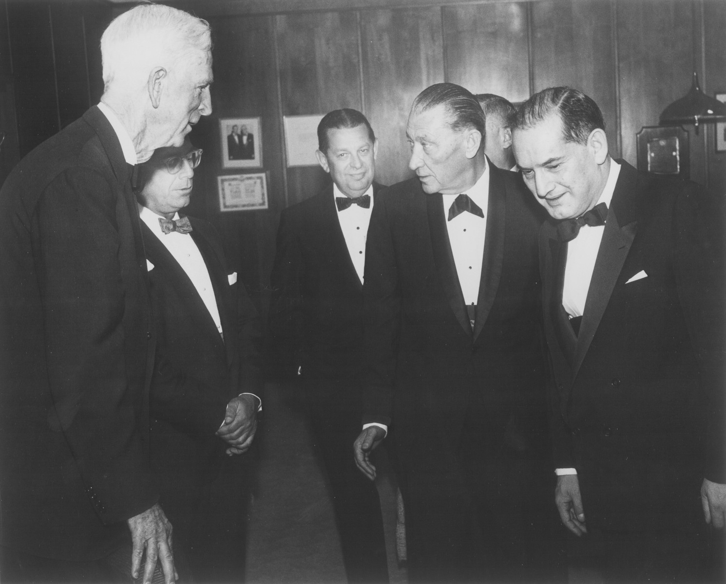 American Jewish philanthropist Abraham S. Kay speaks to James G. McDonald and others at an affair in Washington, D.C.

Pictured from left to right are: James G. McDonald, unknown, Stanley Weiner, Abraham S. Kay and Abraham Harman (right, foreground).