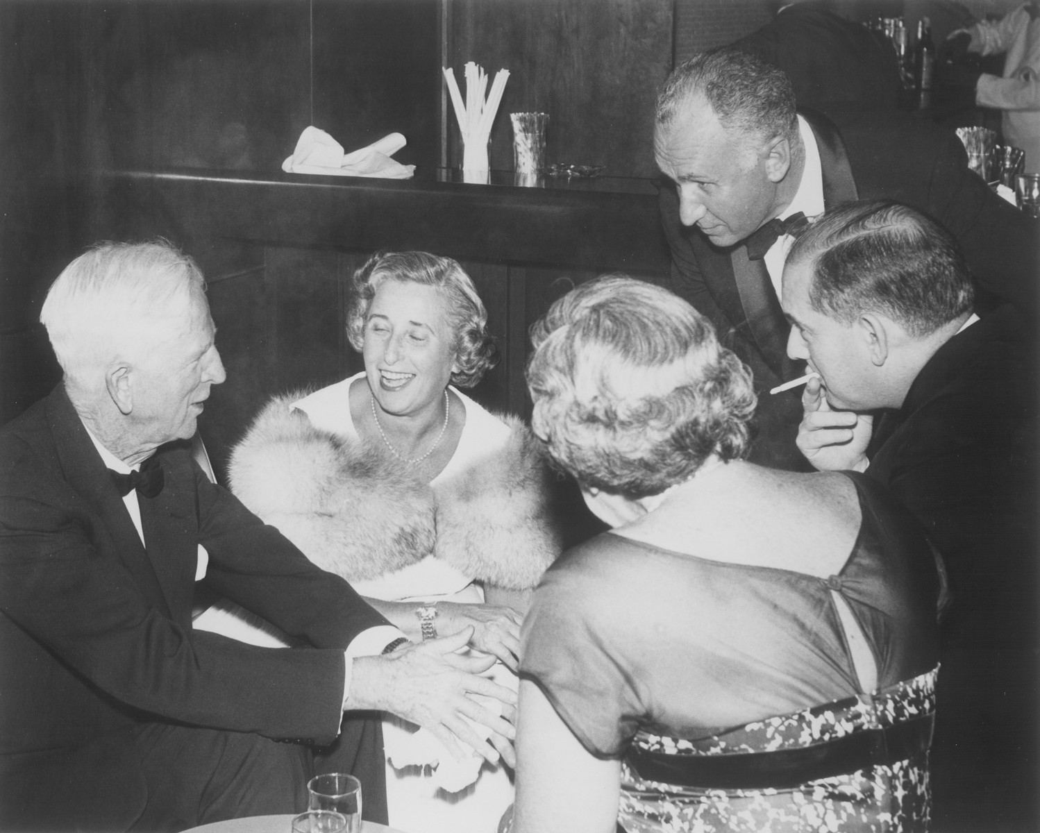 American Jewish philanthropist Abraham S. Kay speaks to James G. McDonald and others at an affair in Washington, D.C.

Among those pictured are: James G. McDonald (left), Abraham S. Kay (top right) and Abraham Harman (far right with cigarette).