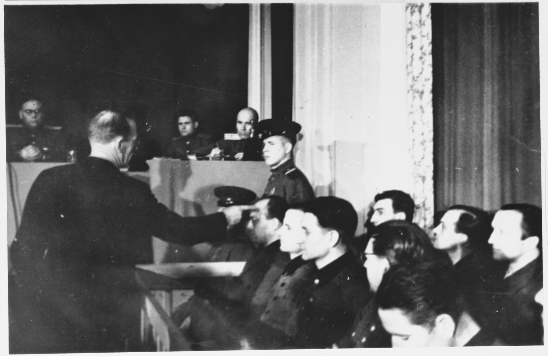 A witness identifies one of the defendants at the Sachsenhausen concentration camp war crimes trial in Berlin.