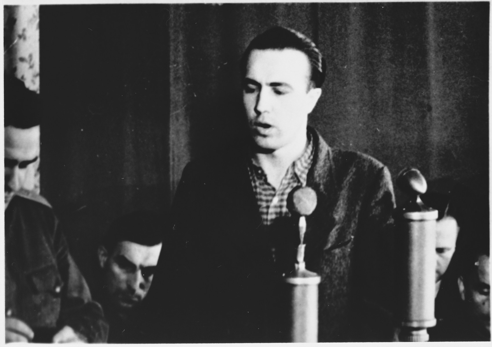 Defendant Ernst Brennscheidt speaks from the dock at the Sachsenhausen concentration camp war crimes trial in Berlin.