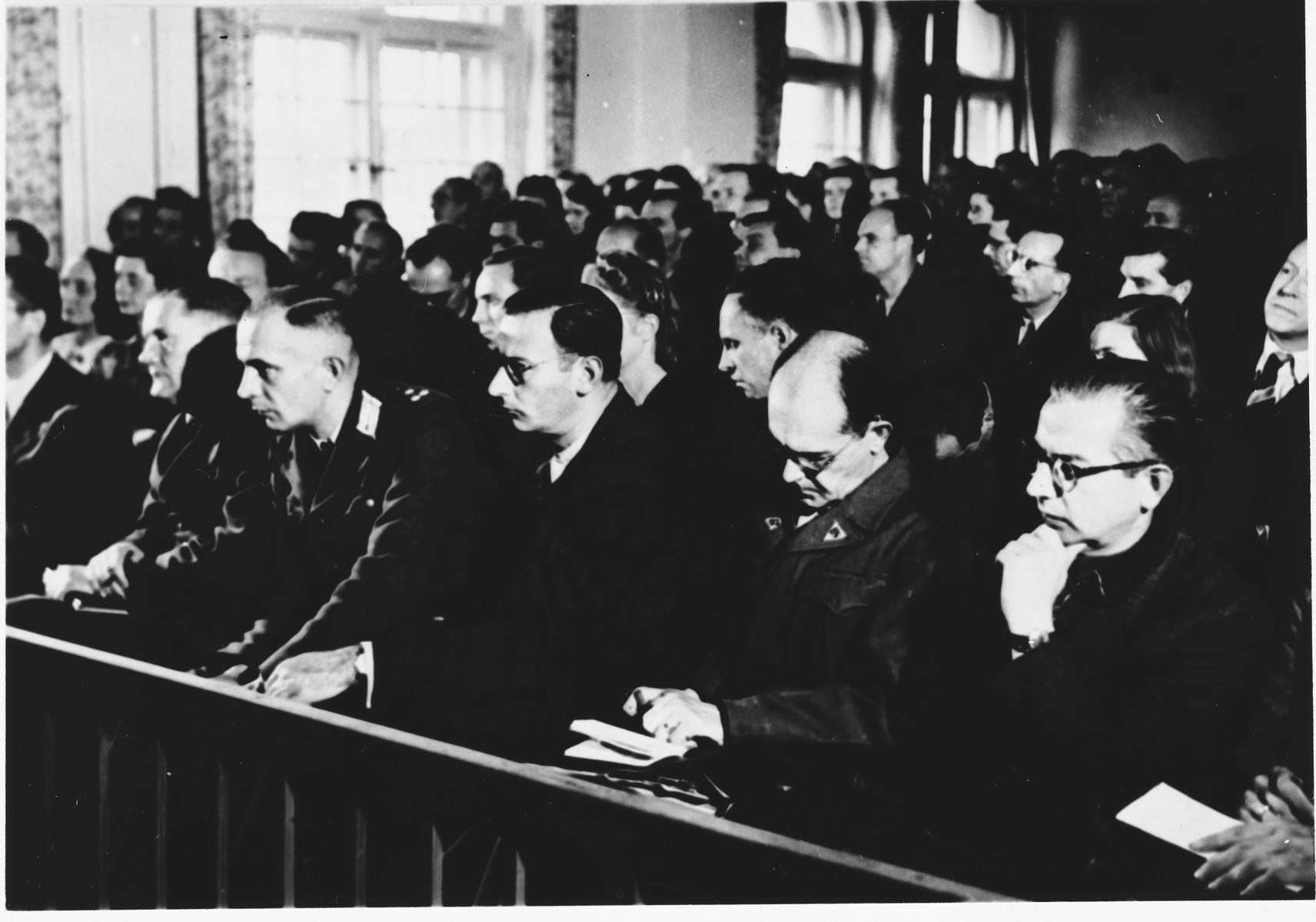 Spectators watch the proceedings at the Sachsenhausen concentration camp war crimes trial in Berlin.