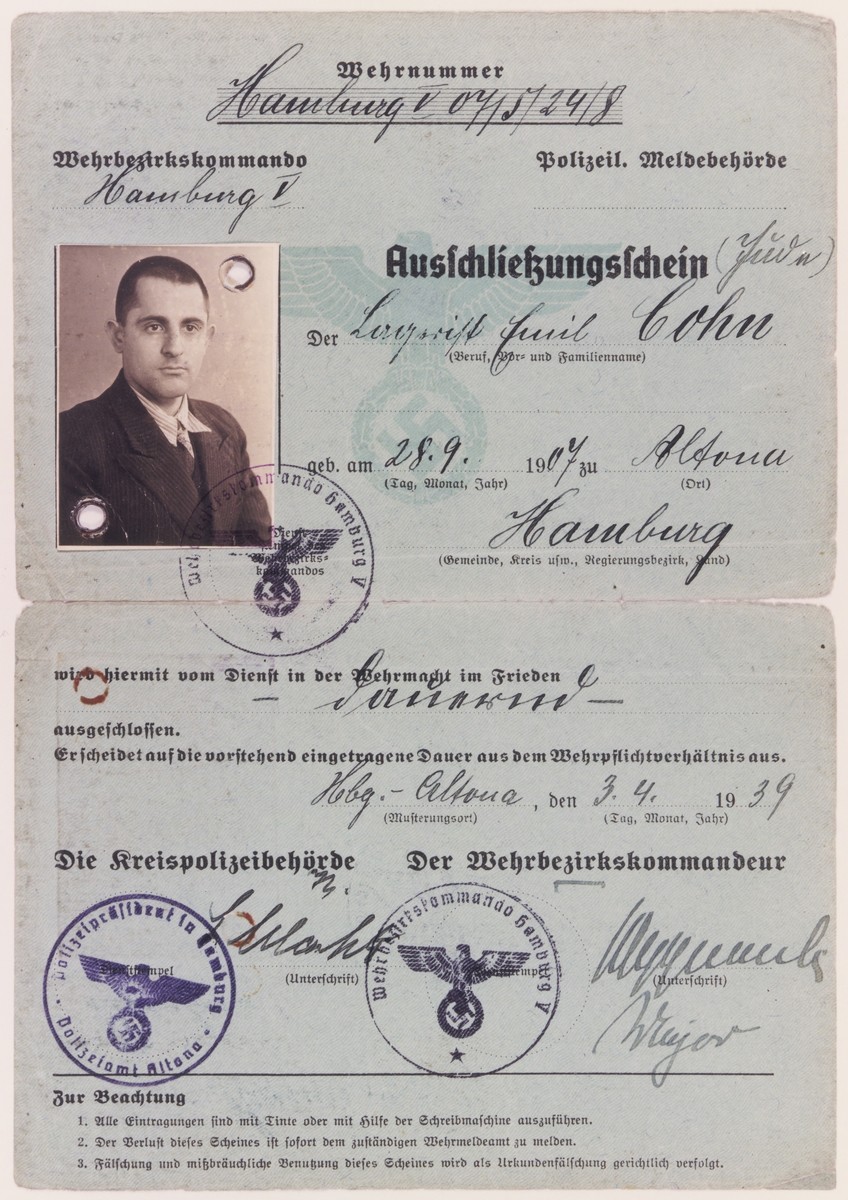 Certificate of exclusion issued by the District Police of Hamburg to Emil Cohn (b. September 28, 1907 in Altona) on April 3, 1939, stating that the holder is prohibited from serving in the military during peacetime because he is a Jew.

The document lists Cohn's occupation as "Lagerist" [camp inmate].